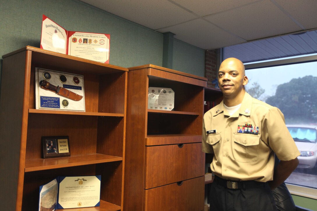 Petty Officer 1st Class V. Casino Eatmon, the leading petty officer with the Chaplains Religious Enrichment Development Operation aboard Camp Lejeune gazes at an award he received during his deployment to Africa. On Feb. 10, 2004 Eatmon was diagnosed with Acute Myeloid Leukemia. Since that time he has deployed to Africa and served aboard a Navy vessel out of Norfolk, Va.