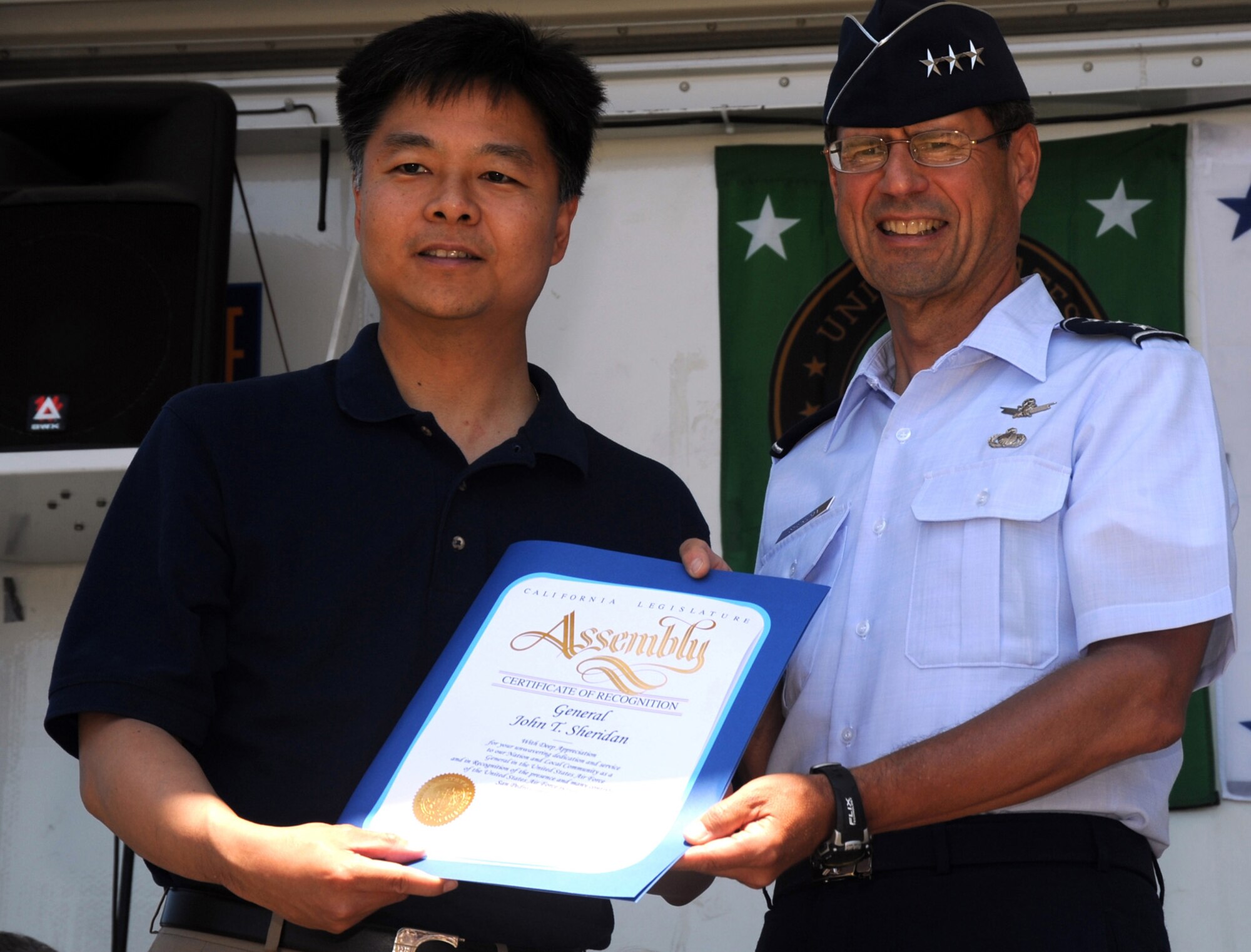 State Assemblyman Ted Lieu presents a certificate of appreciation to Lt. Gen. Tom Sheridan, SMC commander, at the annual Taste in San Pedro, Aug. 2. In addition to the general, representatives from the Navy and Coast Guard were recognized by local elected officials.  (Photo by Atiba S. Copeland) 