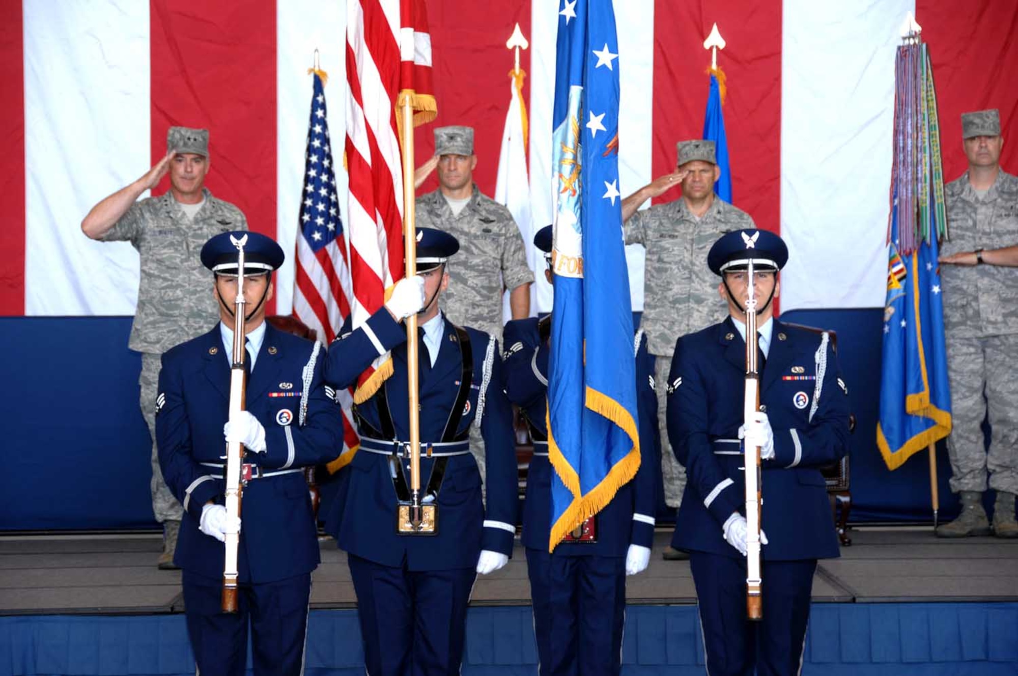 Members of the Travis Honor Guard present the colors during the 60th Air Mobility Wing change-of-command ceremony July 17. (U.S. Air Force photo/Nan Wylie)