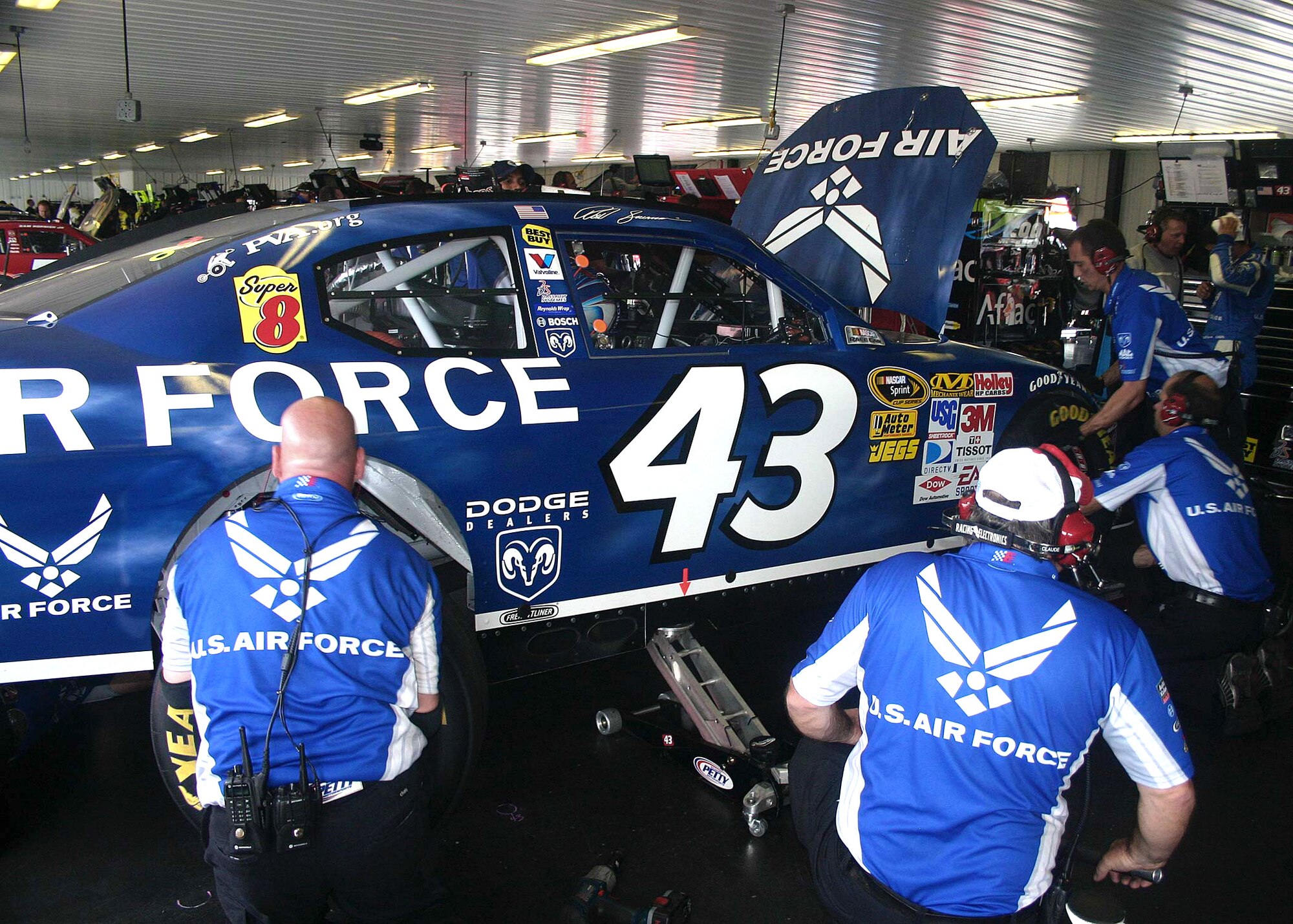Crew members prepare the No. 43 car for a practice run at the Pocono Raceway. The Pennsylvania 500 was the fifth and final race of the season featuring the Air Force paint scheme. The Air Force is also an associate sponsor for the Richard Petty  Motorsports team in 33 other NASCAR races. (U.S. Air Force photo/Dale Eckroth)
