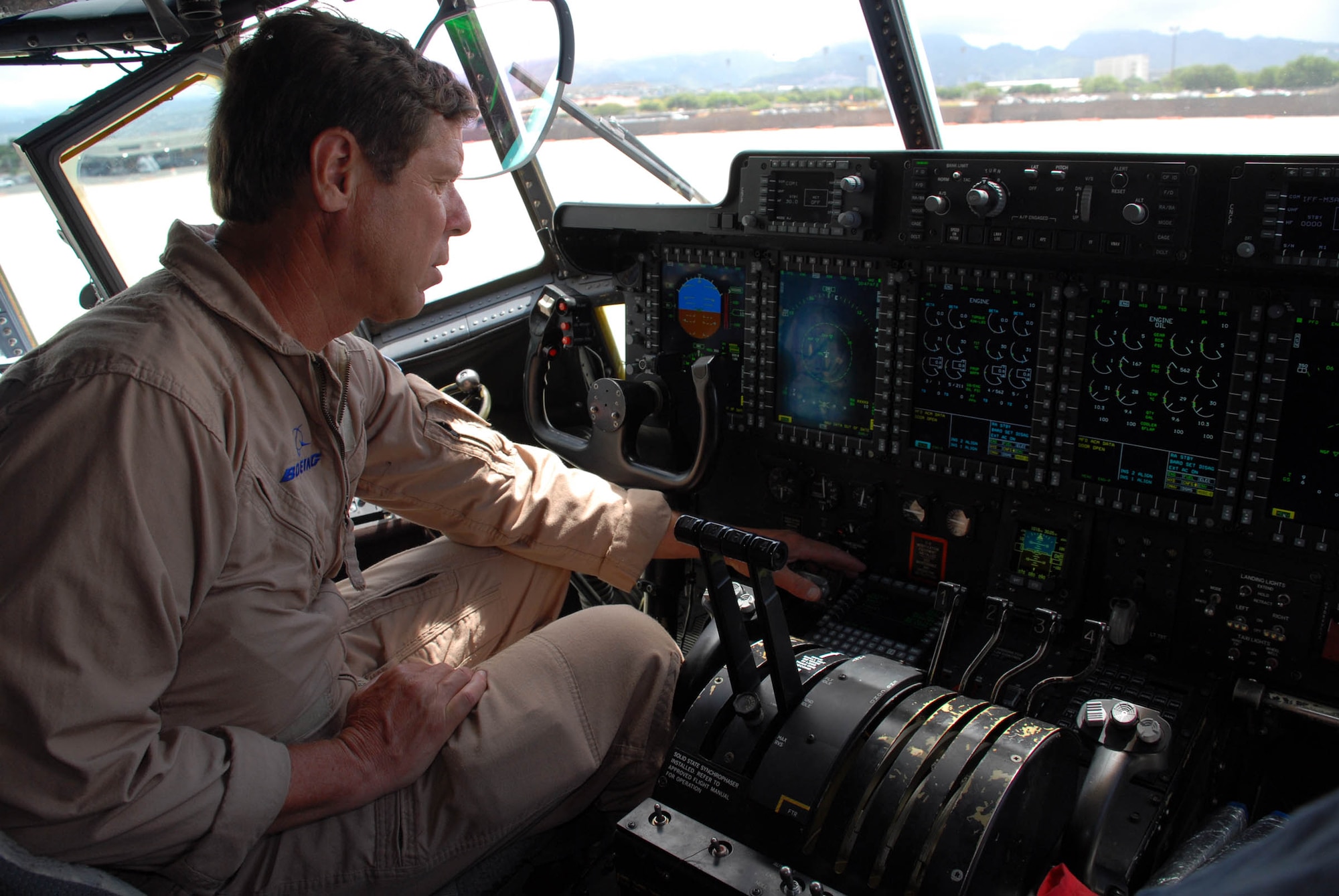 HICKAM AIR FORCE BASE, Hawaii -- Dan Wells, a Boeing pilot, performs preflight tests on an Edwards Air Force Base, Calif., C-130 which was recently converted from analog systems to digital. The aircraft and its crew landed here during an eight-day integrated systems evaluation. They flew across international datelines and the equator to ensure all the upgraded systems would operate smoothly.The conversion was in line with the Air Force’s avionics modernization program, and the Air Force plans to buy 265 of the upgraded C-130s once testing is complete. (U.S. Air Force photo/Staff Sgt. Carolyn Viss)