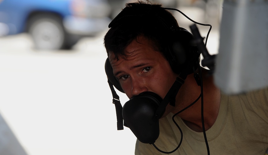 MOODY AIR FORCE BASE, Ga. -- Senior Airman Justin Pueblo, 23rd Aircraft Maintenance Squadron, 75th Aircraft Maintenance Unit weapons specialist, looks to a fellow Airman to receive an order while downloading an A-10C Thunderbolt II during an operational readiness exercise here Aug. 4. (U.S. Air Force photo by Airman 1st Class Joshua Green)
