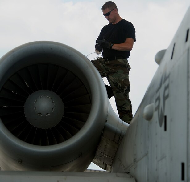 MOODY AIR FORCE BASE, Ga. -- Staff Sgt. Justin Stone, 23rd Aircraft Maintenance Squadron, 75th Aircraft Maintenance Unit crew chief, performs an intake inspection on an A-10C Thunderbolt II during an operational readiness exercise here Aug. 4. (U.S. Air Force photo by Airman 1st Class Joshua Green)