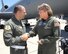 Col. James Vechery, 60th Air Mobility Wing commander, congratulates Senior Master Sgt. Sara Galivin, a flight engineer for the 9th Air Refueling Squadron, on surpassing10,000 flying hours after a recent refueling mission. (U.S. Air Force photo/Nan Wylie)