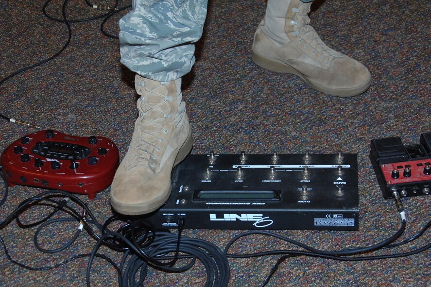 OFFUTT AIR FORCE BASE, Neb.-- Senior Master Sgt. James "Jimmy" Weber, superintendant for the Heartland of America Band,  uses a loop machine, which captures live beats that he plays back throughout his songs during the July 31, 2009 Lunch Bachs concert at the Community Activity Center. The Lunch Bach is a free four-part series during the Offutt lunch hour. US Air Force photo by Kendra Williams