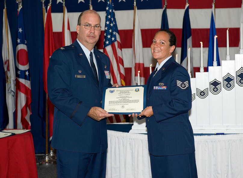 Thirty-one NCOs attended the 512th Airlift Wing NCO Induction Ceremony Aug. 2 at the Landings. The Airmen were promoted to staff sergeant over the past year. The ceremony, hosted by the wing's Top 3, formally inducted these Airmen into the NCO corps. (U.S. Air Force photo/Jason Minto)