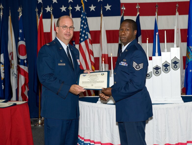 Thirty-one NCOs attended the 512th Airlift Wing NCO Induction Ceremony Aug. 2 at the Landings. The Airmen were promoted to staff sergeant over the past year. The ceremony, hosted by the wing's Top 3, formally inducted these Airmen into the NCO corps. (U.S. Air Force photo/Jason Minto)