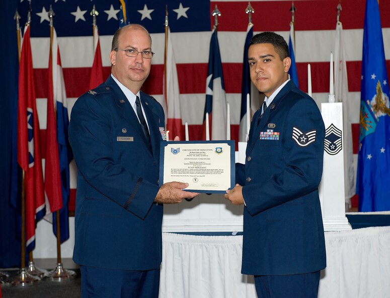 Thirty-one NCOs attended the 512th Airlift Wing NCO Induction Ceremony Aug. 2 at the Landings. The Airmen were promoted to staff sergeant over the past year. The ceremony, hosted by the wing's Top 3, formally inducted these Airmen into the NCO corps. (U.S. Air Force photo/Jason Minto)