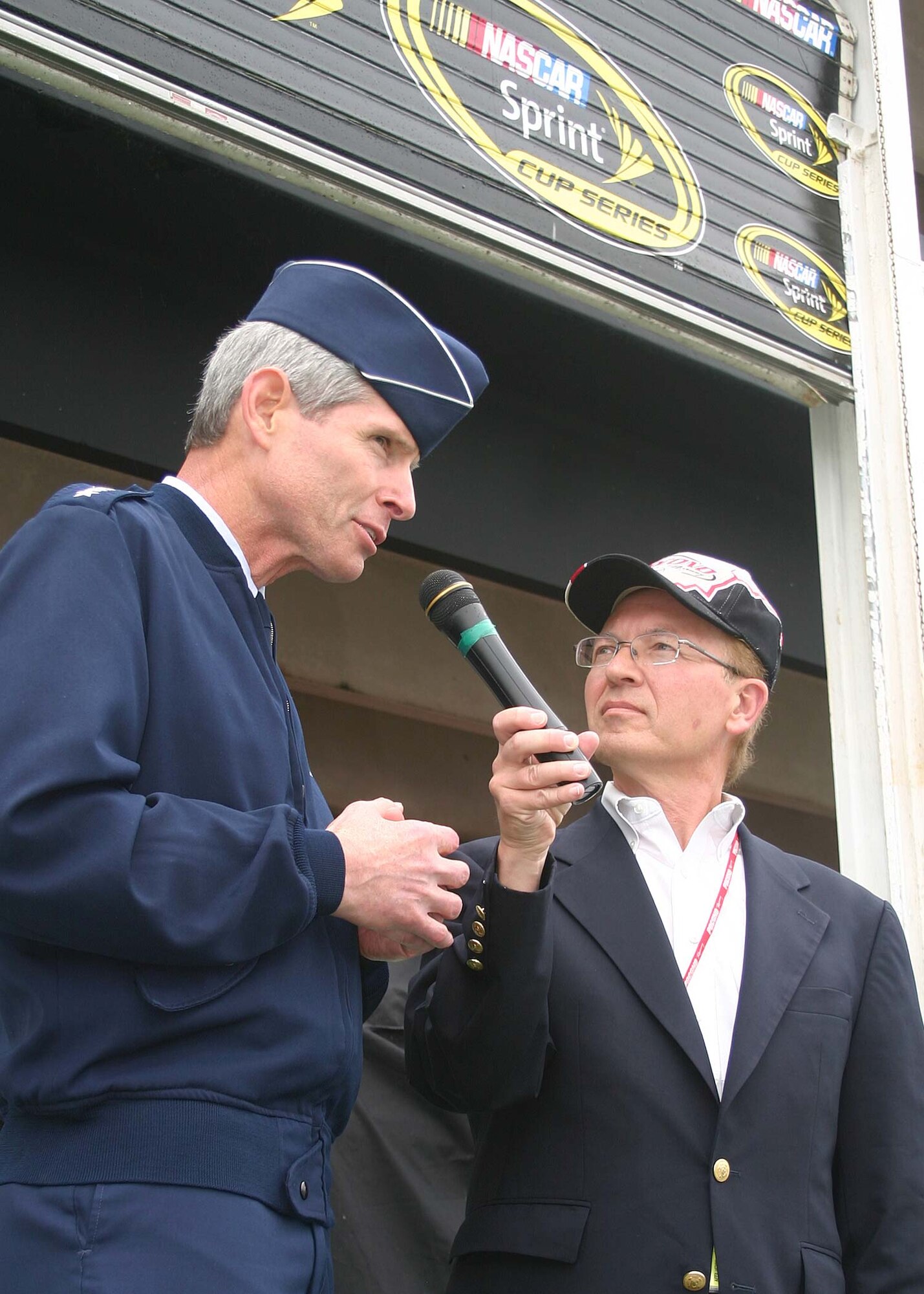 Earl Krause, Pocono Raceway announcer, introduces Air Force Chief of Staff Gen. Norton Schwartz as the Grand Marshal for the Pennsylvania 500 NASCAR race Aug. 2. The Pennsylvania 500 was the Air Force's fifth and final race of the season featuring the Air Force paint scheme. (U.S. Air Force photo/Dale Eckroth)