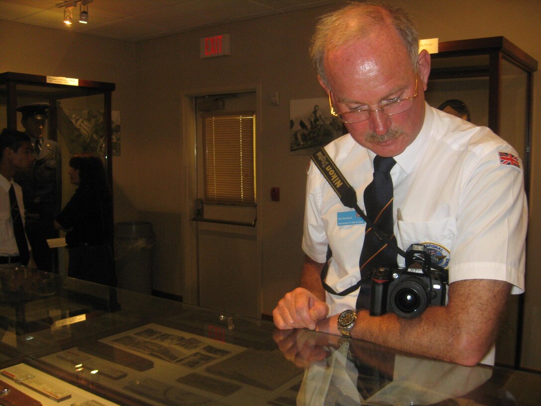 Flight Lt. Paul Woodcock, Royal Air Force Volunteer Reserve in the United Kingdom, reviews a Heritage Center display at Sheppard Air Force Base July 30 during a recent base tour as part of the annual International Air Cadet Exchange.  The group comes to the United States annually to become acclimated with the countries culture and military practices. (U.S. Air Force photo/Debi Smith)