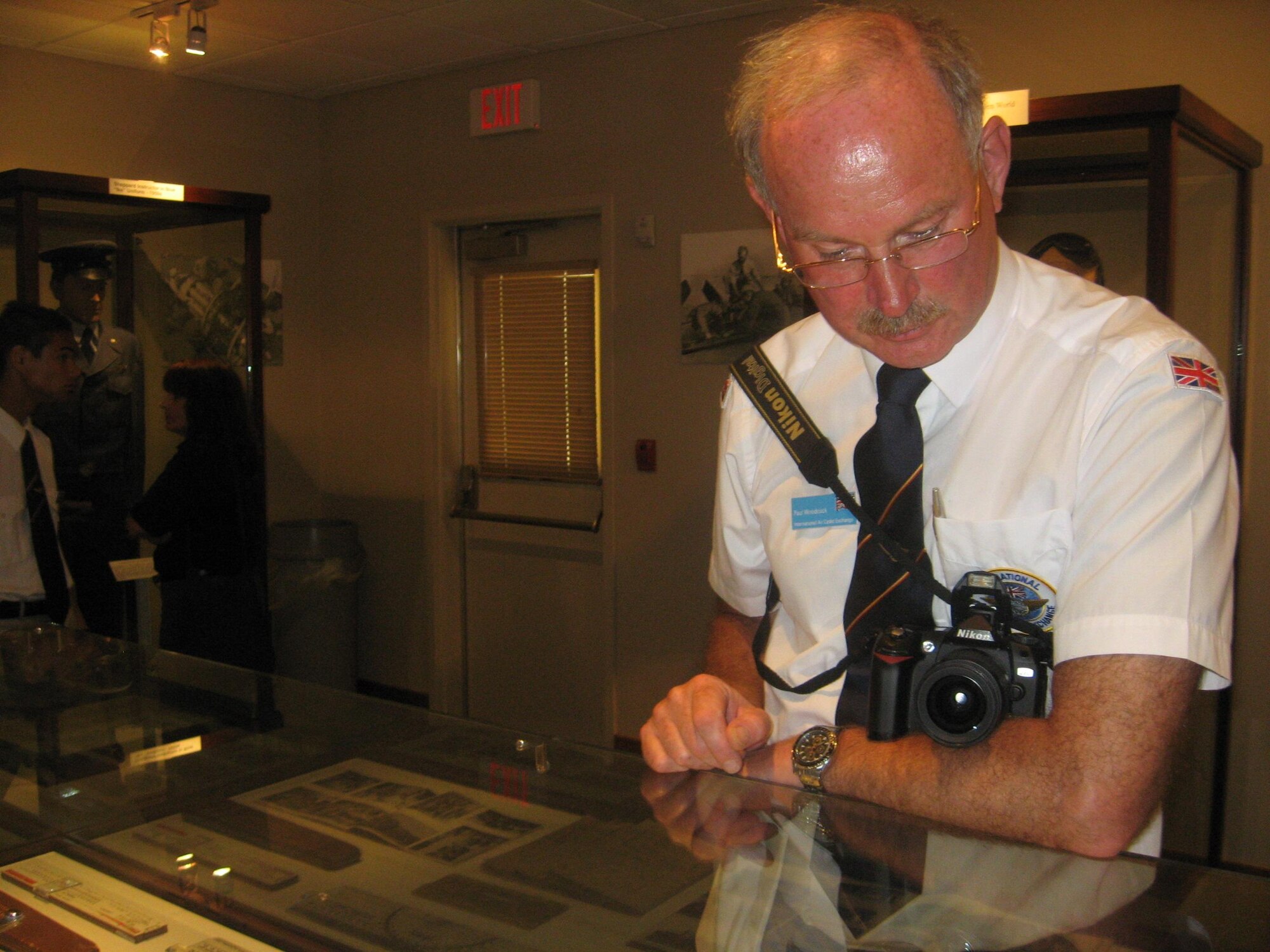 Flight Lt. Paul Woodcock, Royal Air Force Volunteer Reserve in the United Kingdom, reviews a Heritage Center display at Sheppard Air Force Base July 30 during a recent base tour as part of the annual International Air Cadet Exchange.  The group comes to the United States annually to become acclimated with the countries culture and military practices. (U.S. Air Force photo/Debi Smith)