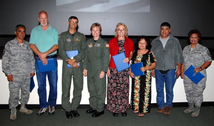 TRAVIS AIR FORCE BASE, Calif. -- Thirty Years: Seven civilians assigned to the 349th Air Mobility Wing were recognized Aug. 5, 2009 at a civilian commander’s call. Brig. Gen. Maryanne Miller, wing commander,(pictured at center), presented 30 year civil service certificates to, from the left: Victor Camacho, Garry Cothran, Robert Fletcher; Brig. Gen. Miller; Diane Leister, Giana McClinton, Mariano Mejia and Corazon Riate. (U.S. Air Force photo/Senior Master Sgt. Ellen Hatfield)  
