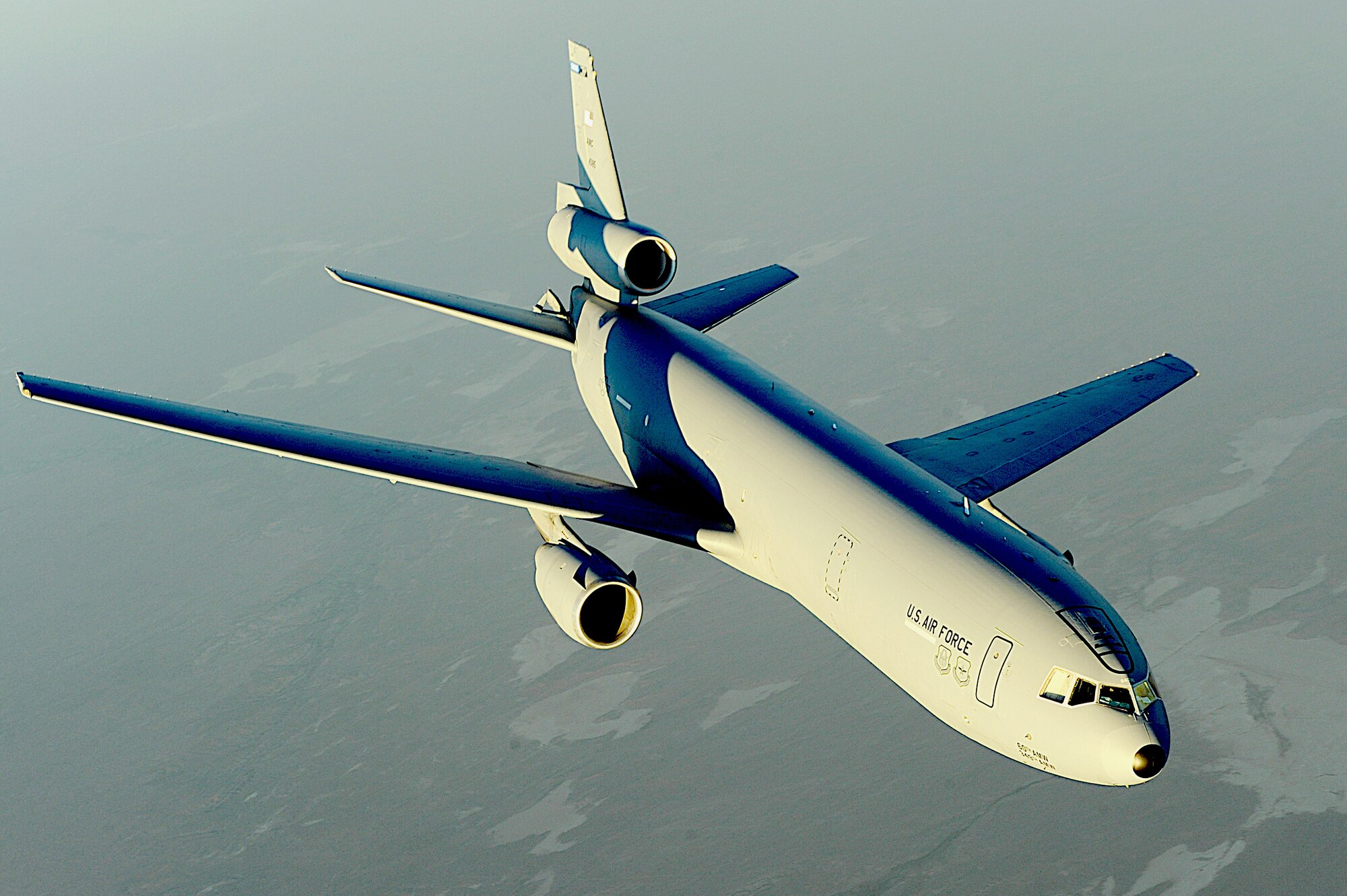 A KC-10 Extender flies over Afghanistan. Using either an advanced aerial refueling boom, or a hose and drogue centerline refueling system, the KC-10 can refuel a wide variety of U.S. and allied military aircraft within the same mission. (U.S. Air Force photo/Staff Sgt. Aaron Allmon)