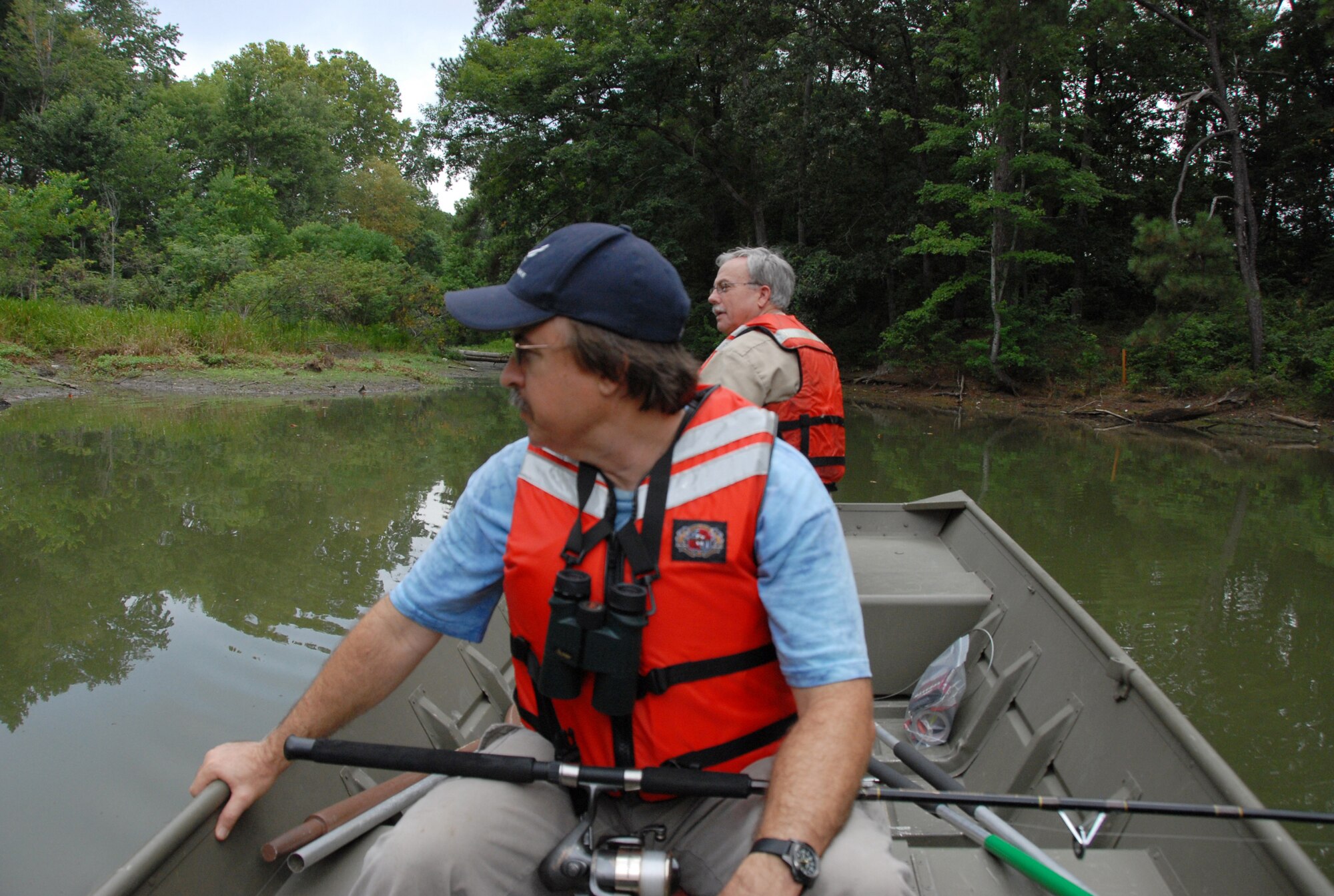 Dr. Bob Sargent, natural resources manager at Robins, and Danny Jones, supervisor of the Entomology Shop search Duck Lake for an elusive alligator that has been sighted in the area. U. S. Air Force photo by Wayne Crenshaw