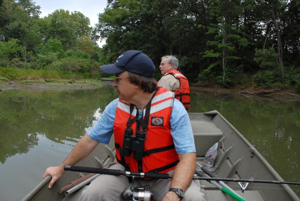 Dr. Bob Sargent, natural resources manager at Robins, and Danny Jones, supervisor of the Entomology Shop search Duck Lake for an elusive alligator that has been sighted in the area. U. S. Air Force photo by Wayne Crenshaw