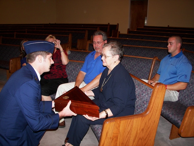 Capt. Matthew McNulty from the 16th Airlift Squadron, presented a United States flag to the surviving widow of 2nd Lt. Billie Joe Bullard July 30 in N.C. According to casualty reports, Lieutenant Bullard was declared deceased seven days after his aircraft went down in the Atlantic Ocean, 18 miles east of North Truro, Mass., Feb. 1, 1957. (Courtesey photo)
