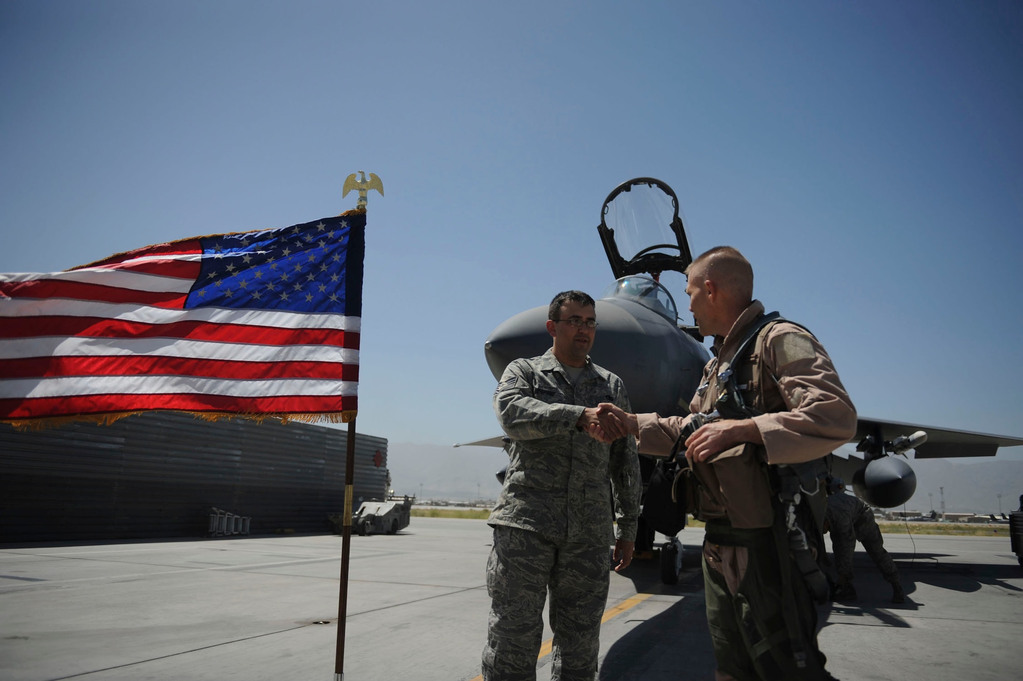 BAGRAM AIRFIELD, Afghanistan - Tech. Sgt. Lucas Dechant, a 12-year Air Force veteran, reenlists in front of an F-15E Strike Eagle. The 455th Air Expeditionary Wing commander, Brig. Gen. Steven L. Kwast, presided over the ceremony where friends and coworkers from the maintenance squadron gathered. A Denver native, Sergeant Dechant is on his fourth deployment. He is stationed at Seymour Johnson Air Force Base, N.C. (U.S. Air Force photo/Staff Sgt. J.G. Buzanowski)