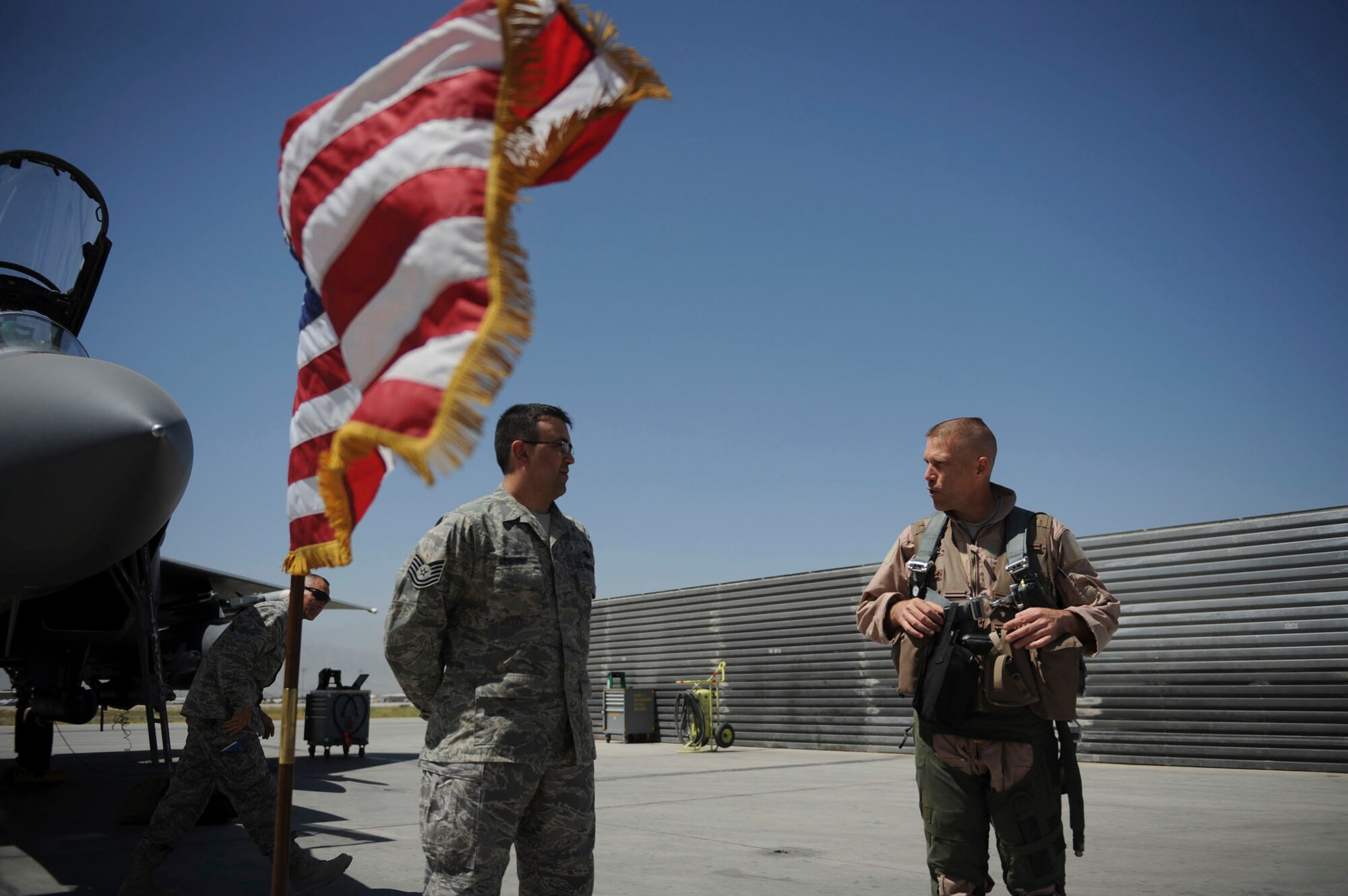 BAGRAM AIRFIELD, Afghanistan - Tech. Sgt. Lucas Dechant, a 12-year Air Force veteran, reenlists in front of an F-15E Strike Eagle. The 455th Air Expeditionary Wing commander, Brig. Gen. Steven L. Kwast, presided over the ceremony where friends and coworkers from the maintenance squadron gathered. A Denver native, Sergeant Dechant is on his fourth deployment. He is stationed at Seymour Johnson Air Force Base, N.C. (U.S. Air Force photo/Staff Sgt. J.G. Buzanowski)