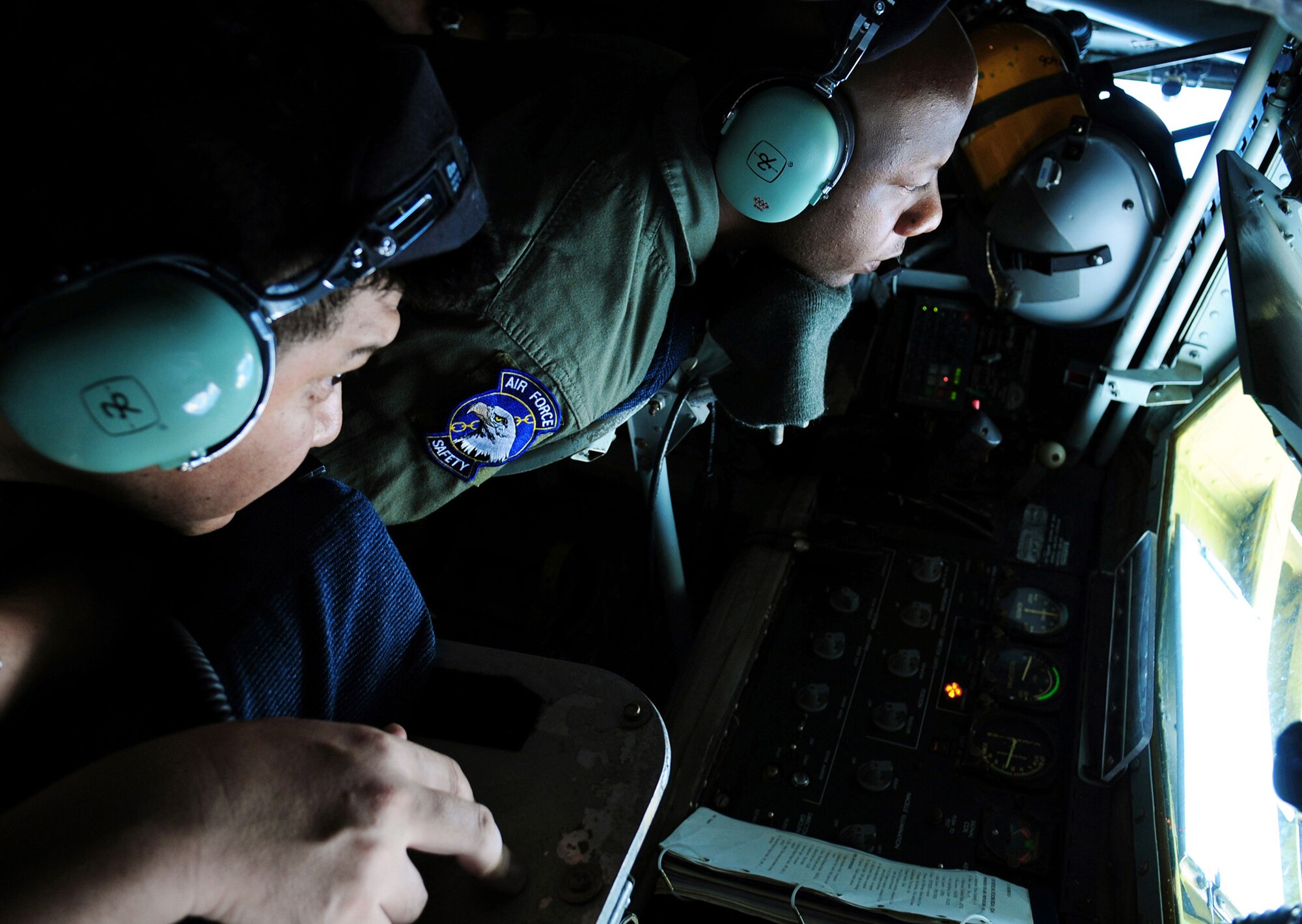 Staff Sgt. Ron McKinney guides the KC-135 Stratotanker boom for a Japan Air Self Defense Force F-15 as the pilot practices air refueling July 30 off the coast of Japan. The training is in preparation for JASDF participation in Red Flag-Alaska this year. Sergeant McKinney is a KC-135 boom operator with the 909th Air Refueling Squadron, Kadena Air Base, Japan. (U.S. Air Force photo/Tech. Sgt. Angelique Perez) 
