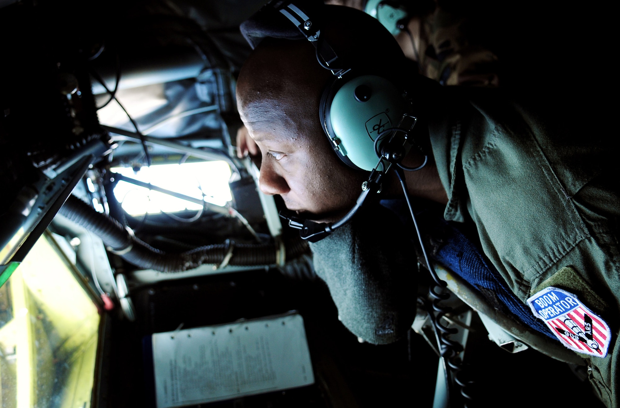 Staff Sgt. Ron McKinney guides the KC-135 Stratotanker boom for a Japan Air Self Defense Force F-15 as the pilot practices air refueling July 30 off the coast of Japan. The training is in preparation for JASDF participation in Red Flag-Alaska this year. Sergeant McKinney is a KC-135 boom operator with the 909th Air Refueling Squadron, Kadena Air Base, Japan. (U.S. Air Force photo/Tech. Sgt. Angelique Perez) 