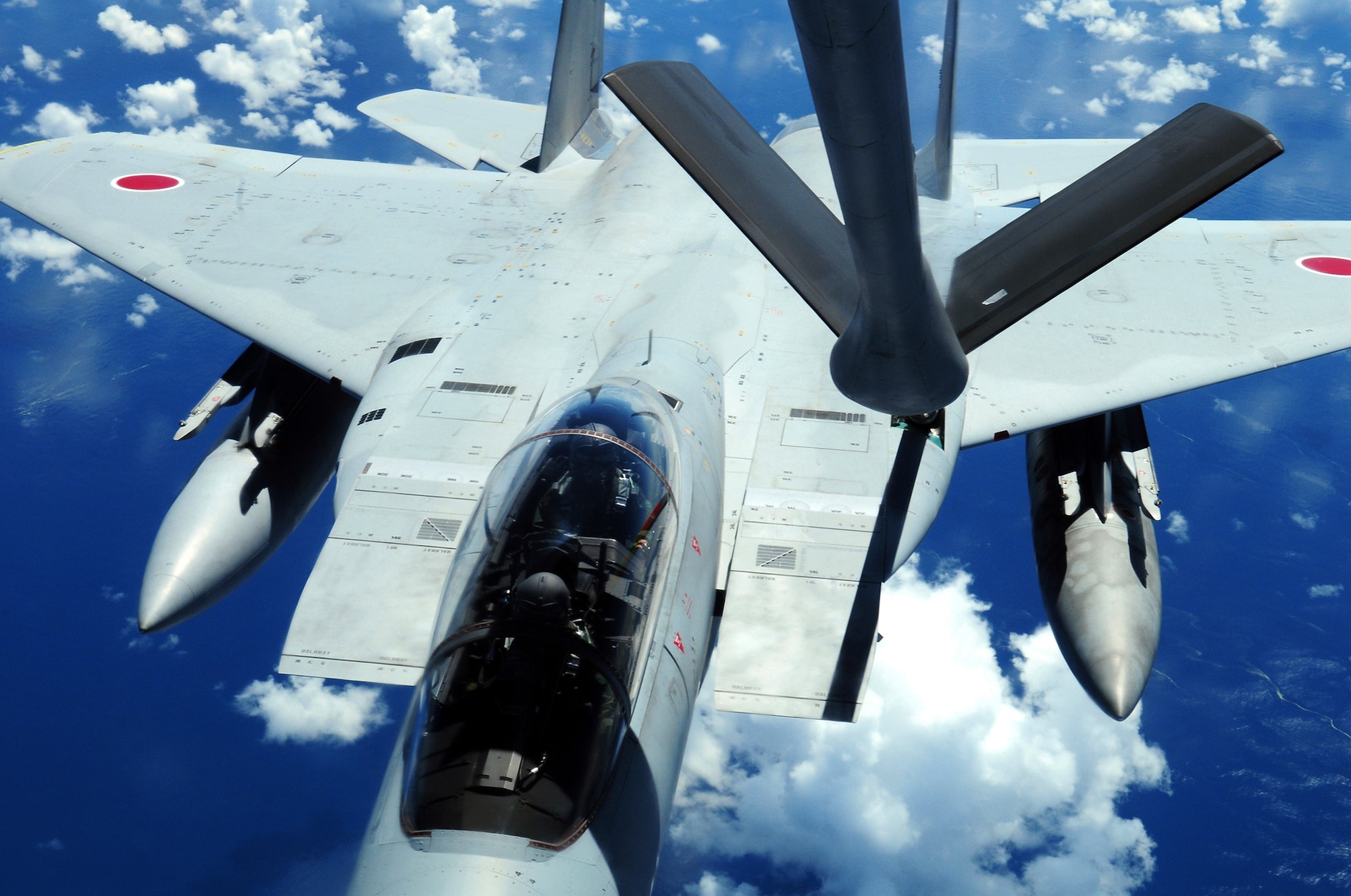 A Japan Air Self Defense Force F-15 is refueled by a U.S. Air Force KC-135 Stratotanker during air refueling training July 30 off the coast of Japan. The training is in preparation for JASDF participation in Red Flag-Alaska. The KC-135 is from the 909th Air Refueling Squadron, Kadena Air Base, Japan. (U.S. Air Force photo/Tech. Sgt. Angelique Perez) 