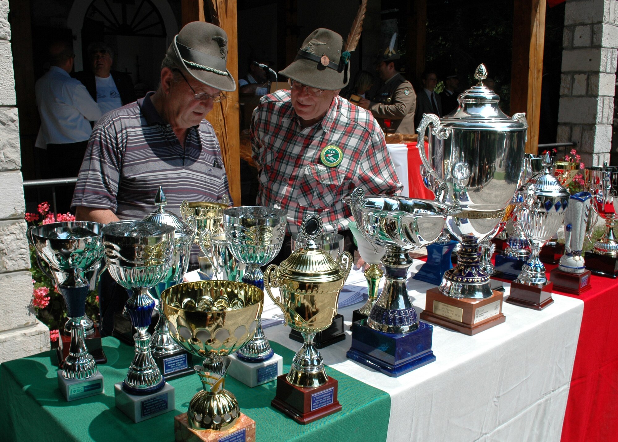 Members of the Alpini alumni association tally up the standings from the annual 7-kilometer run held at Piancavallo, Italy, Aug. 2, 2009, before Italian civic leaders from the Friuli-Venezia Giulia region and 31st Fighter Wing senior leaders handed out trophies to the 145 participants.  The wing had 11 of the 45 teams in the race and received five trophies. (U.S. Air Force photo/Tech. Sgt. Michael O'Connor)