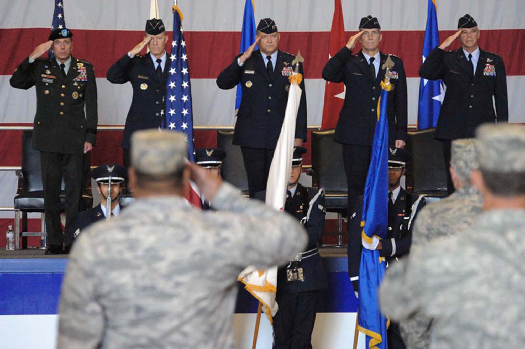 Army Gen. David Petraeus (left to right), Gen. John D.W. Corley, Lt. Gen. Gary North, Lt. Gen. Gilmary Michael Hostage III and Maj. Gen. William L. Holland salute the colors during the 9th Air Force/U.S. Air Force Central change-of-command ceremony Aug 5 at Shaw Air Force Base, S.C. General North relinquished command of 9th AF/USAFCENT, which was re-designated as AFCENT Command and a new headquarters 9th Air Force was activated. General Petraeus is the U.S. Central Command commander, General Corley is the Air Combat Command commander, General North is the outgoing 9th Air Force and U.S. Air Forces Central commander, General Hostage is the receiving USAFCENT Command commander, and General Holland is the receiving 9th Air Force commander. (U.S. Air Force photo/Senior Airman Matt Davis)