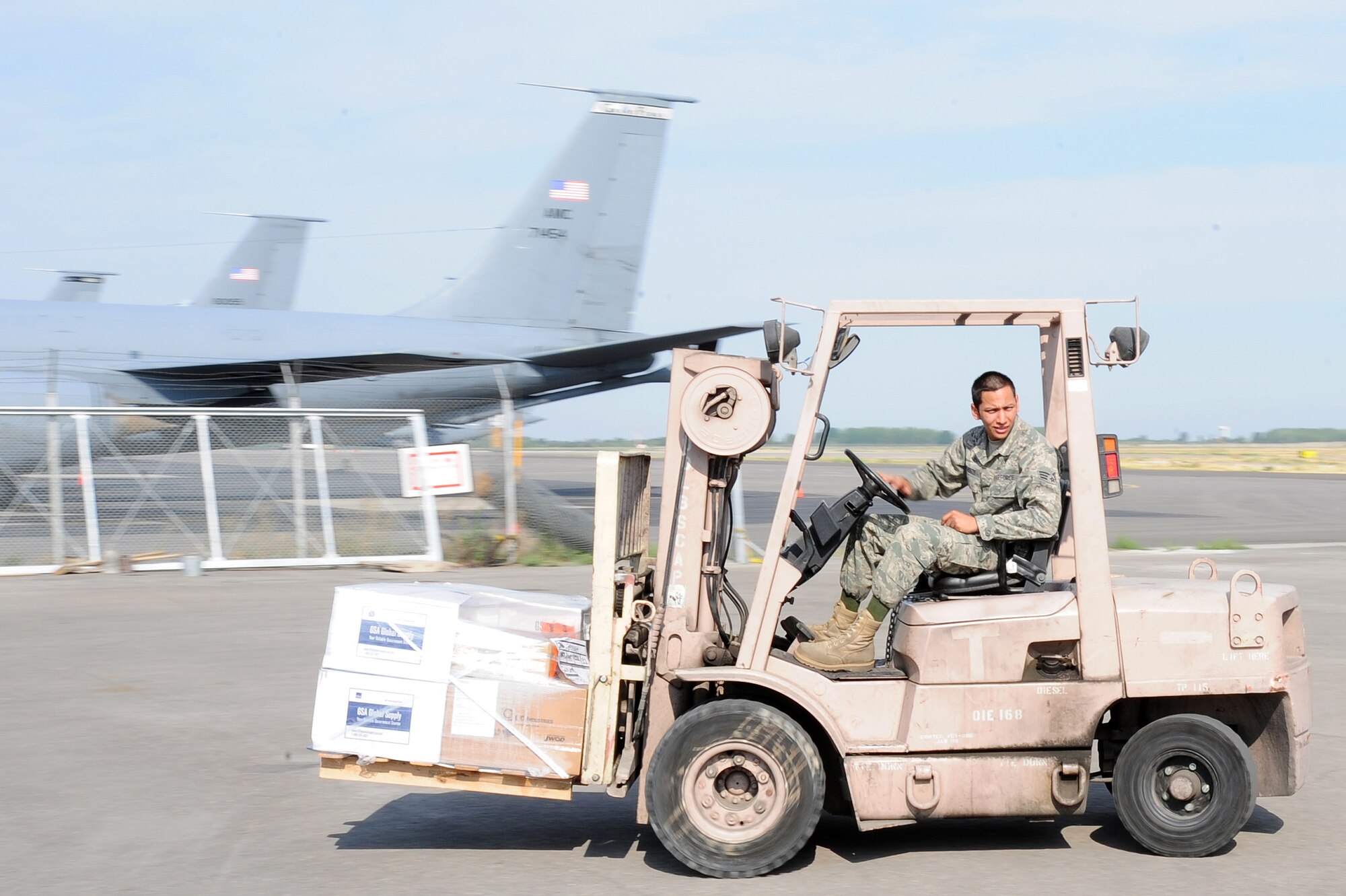 TRANSIT CENTER AT MANAS, Kyrgyzstan -- Senior Airman Jorge Ontiveros, 376th Expeditionary Logistics Readiness Squadron supply warehouse journeyman, transports a pallet at the Transit Center at Manas. Airman Ontiveros is deployed from the 100th LRS at the Royal Air Force Mildenhall, U.K. and is originally from El Paso, Texas. (U.S. Air Force photo/Senior Airman Steele C. G. Britton)