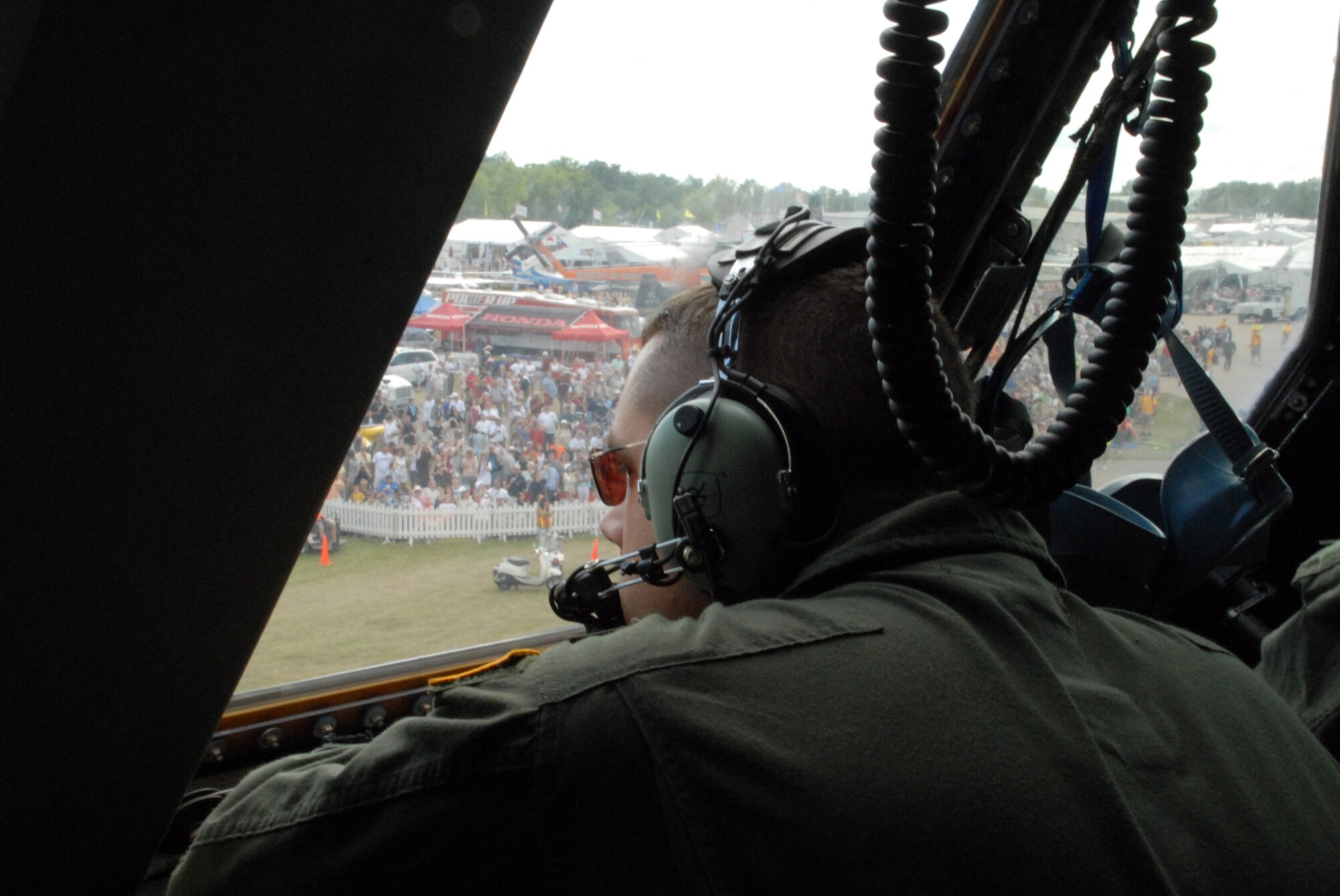 Capt Matt Jaeger, 9th Airlift Squadron pilot, observes the C-5M Super Galaxy as it taxis at the EAA AirVenture Oshkosh.  More than 10,000 guests toured the aircraft during The Spirit of Normandy?s two-day visit to the event.  (U.S. Air Force photo/Staff Sgt. Chad Padgett) 