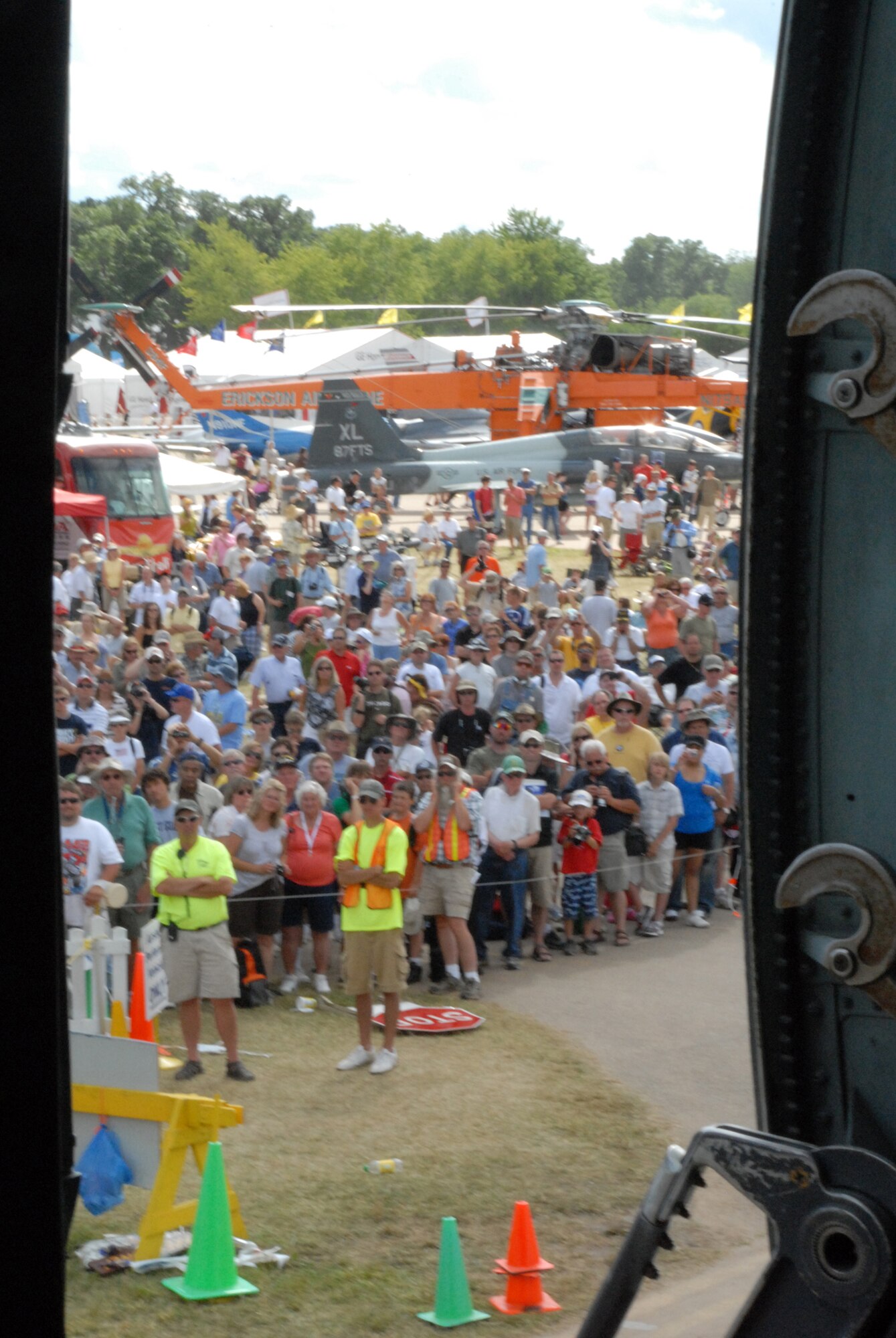 Visitors line up as the C-5M Super Galaxy, The Spirit of Normandy, taxis into location at the EAA AirVenture Oshkosh.  More than 10,000 guests toured the aircraft during The Spirit of Normandy?s two-day visit to the event.  (U.S. Air Force photo/Staff Sgt. Chad Padgett)