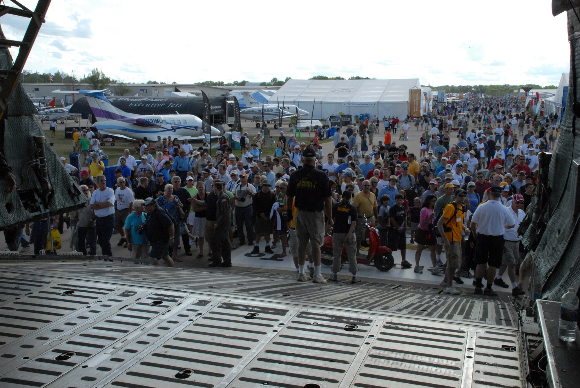 Visitors begin boarding the C-5M Super Galaxy, The Spirit of Normandy, at EAA AirVenture Oshkosh in Wisconsin.  More than 10,000 guests toured the aircraft during The Spirit of Normandy?s two-day visit to the event.  (U.S. Air Force photo/Staff Sgt. Chad Padgett)