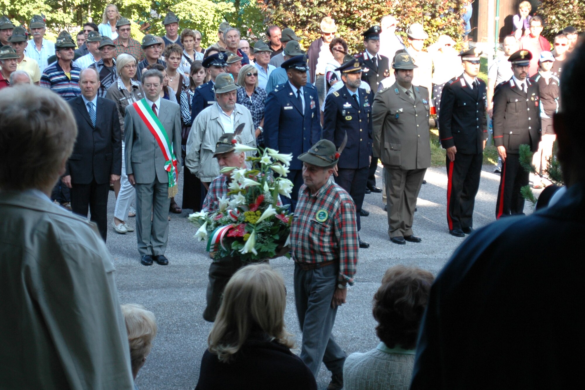 Col. C.Q. Brown, Jr., 31st Fighter Wing commander, Col. Patrick McClelland, 31st FW vice commander and Col. Brian Kelly, 31st Mission Support Group commander, took part in a flag raising and wreath laying ceremony honoring Alpinis past and present, and a holy mass at Piancavallo, Italy, Aug. 2, 2009.  Veterans from the Alpini alumni association hosted these events and other civic leaders from the Friuli-Venezia Giulia region attended. (U.S. Air Force photo/Tech. Sgt. Michael O'Connor)