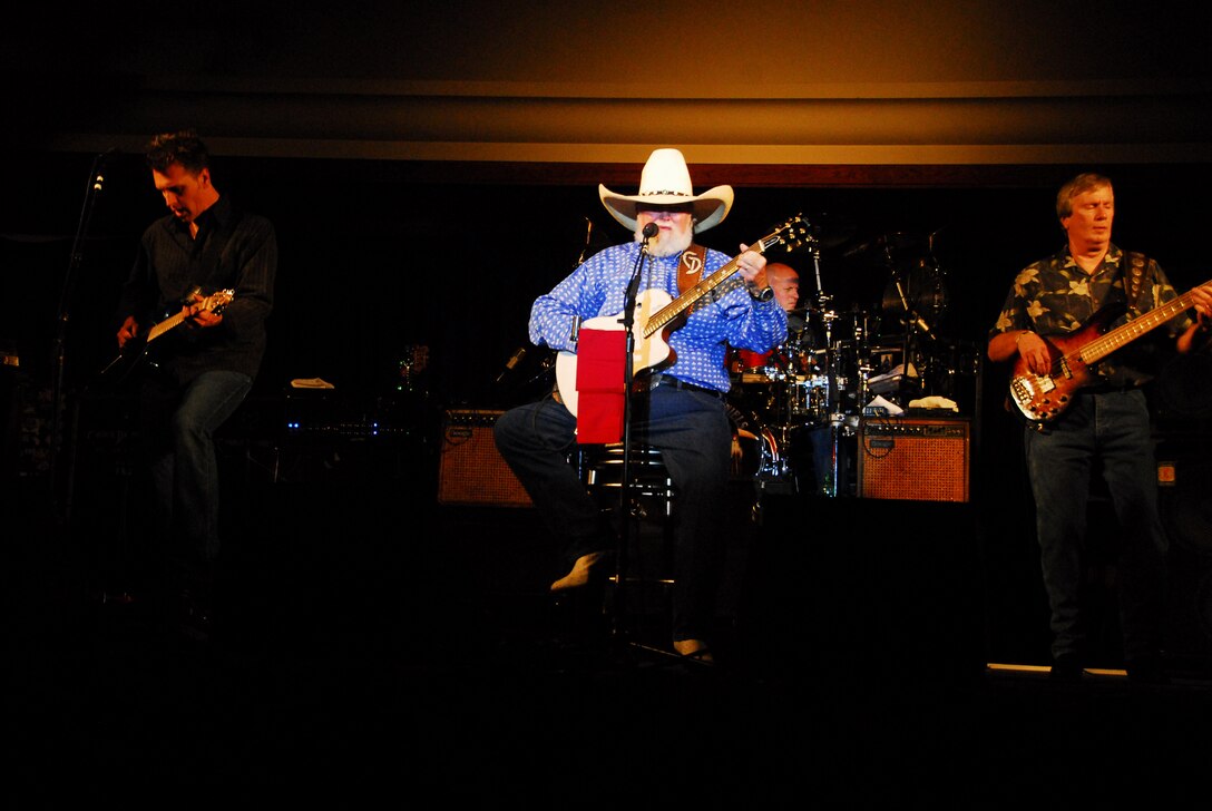 Country music legend Charlie Daniels performs the classic gospel song “How Great Thou Art” during his performance at the Marine Corps Air Station in Yuma, Ariz., Aug. 6, 2009. Daniels and his band were brought to Yuma by the “Spirit of America” tour, which brings headline musical entertainment to stateside military installations.