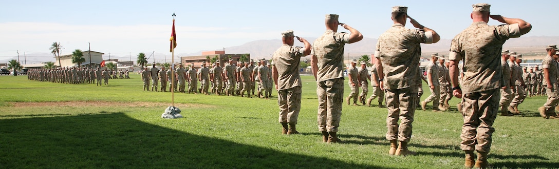 (Right to left) Lt. Col. Clay C. Tipton, the incoming commanding officer of 3rd Battalion, 7th Marine Regiment; Lt. Col. James B. Woulfe, the departing commander; Sgt. Maj. Troy E. Black, the inbound sergeant major; and Sgt. Maj. James J. McCook, the outbound sergeant major, salute during change of command and relief and appointment ceremonies Aug. 7 at the Combat Center’s Lance Cpl. Torrey L. Gray Field.
