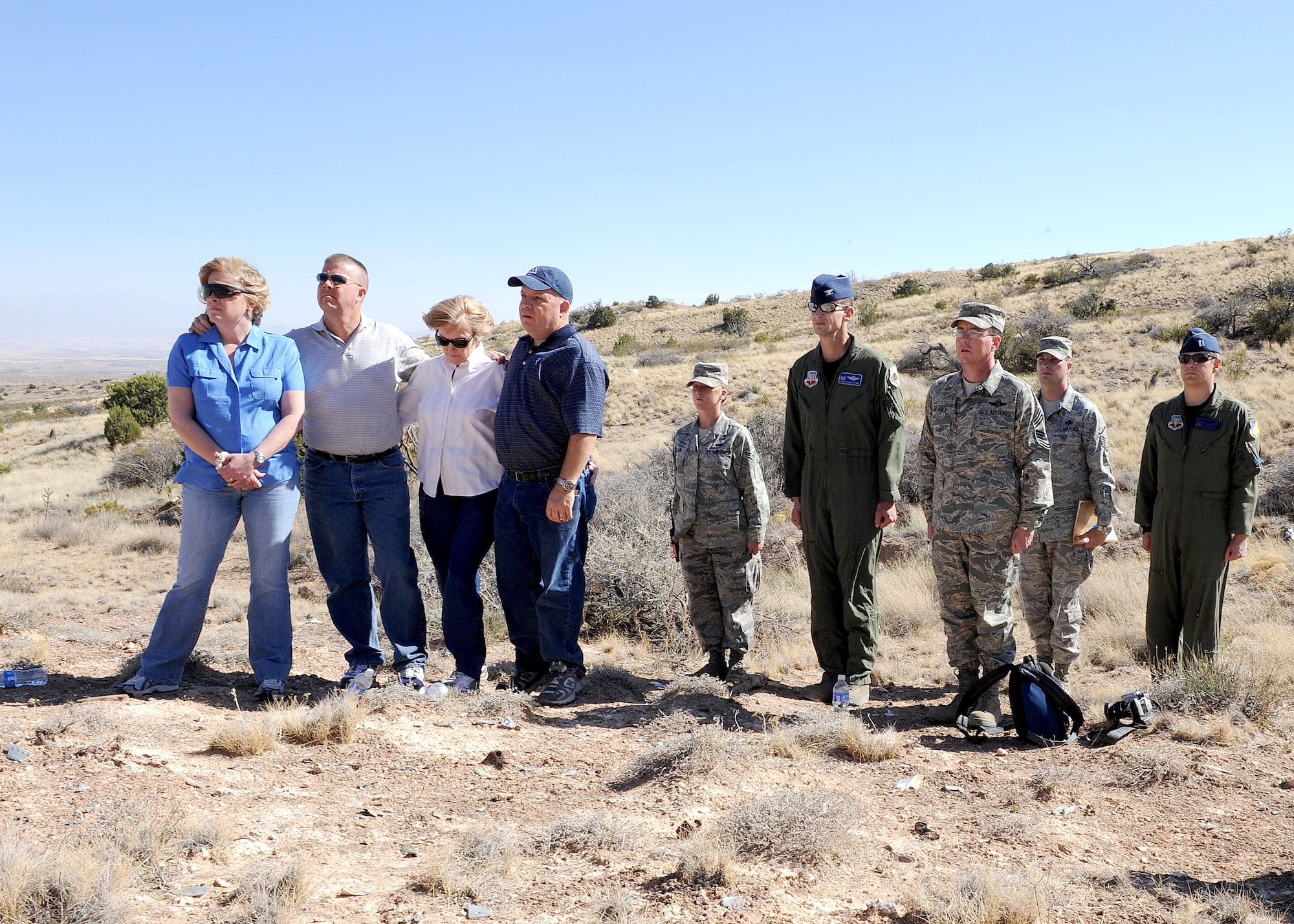 HOLLOMAN AIR FORCE BASE, N.M. -- The Thompson family, Col. Michael Stapleton, 49th Operations Group commander, and other members of Holloman look on during a flag folding presentation March 23, at the Red Rio Range, N.M.  The family was taken on a tour of Holloman and of the crash site of Captain Thompson on the 42nd anniversary of the crash. (U.S. Air Force photo by SrA John D. Strong II)   