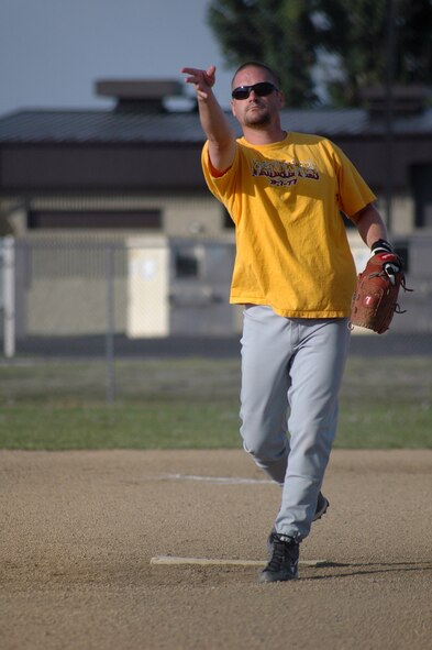 Steve Perl, 120th Fighter Wing, throws a pitch during a 6 p.m. intramural softball playoff game versus the 341st Maintenance Operation Squadron Aug. 4 on field 3. The 120th FW "Vigilantes" finished 4th after the 341st MOS  ended their playoff chances with a 14 to 6 win. (U.S. Air Force photo/Senior Airman Dillon White)  