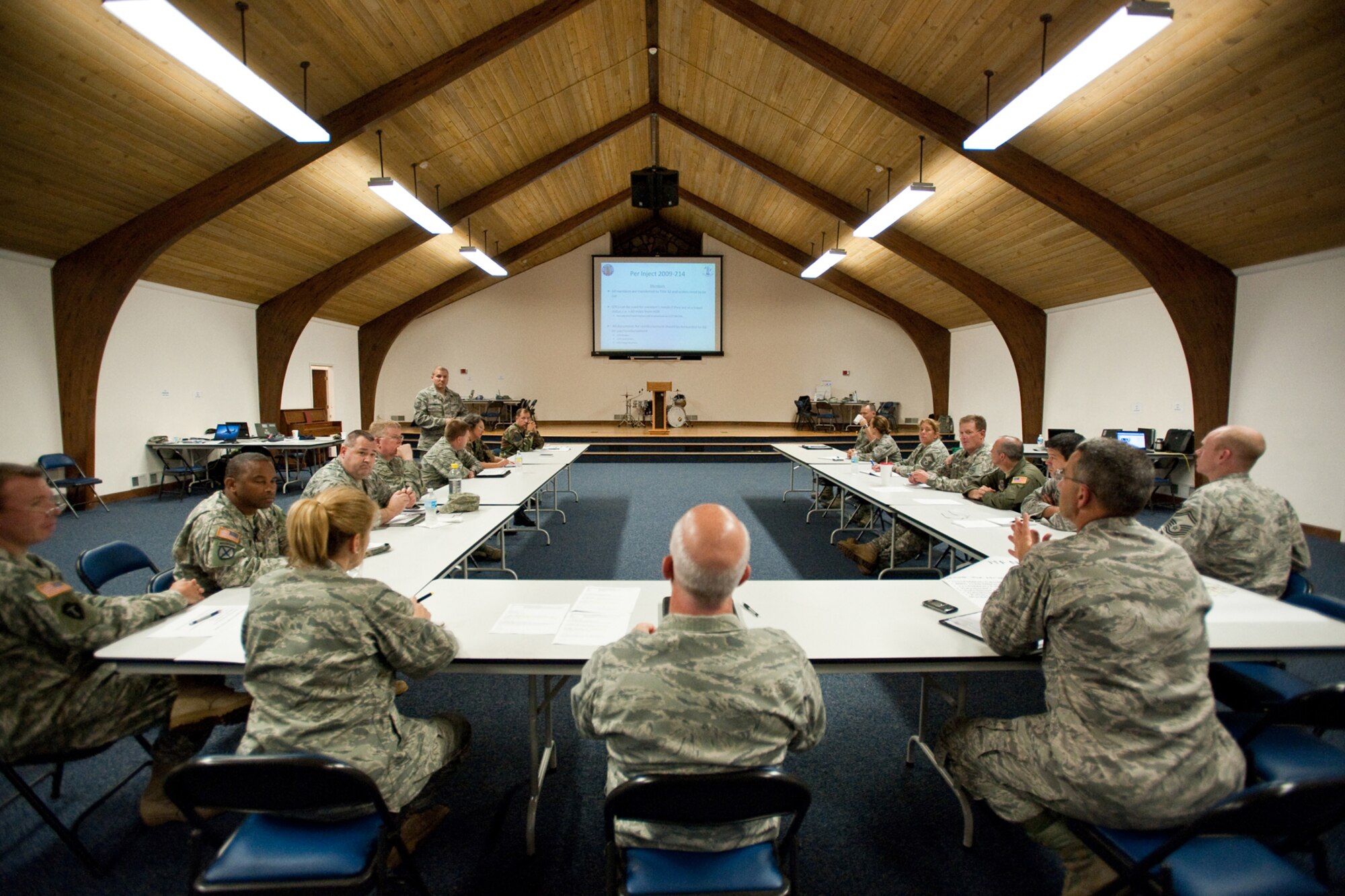Joint Task Force Cardinal officials receive a status update of current operations at the Kentucky Air National Guard Base on Aug. 5 as part of a statewide pandemic-response exercise.