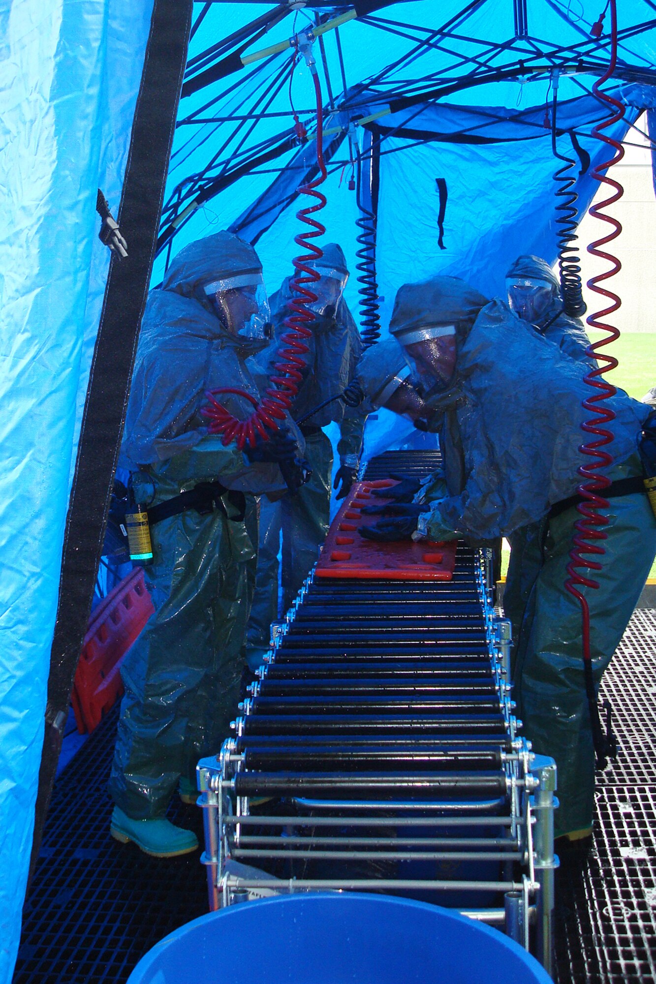 Members of the Kentucky Air Guard's 123rd Medical Group set up a portable decontamination system at Woodford Memorial Hospital in Versailles, Ky., Aug. 5 as part of a statewide pandemic-response exercise.                               
