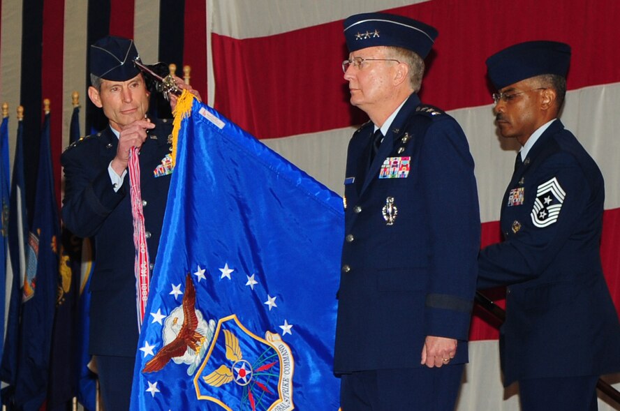 BARKSDALE AIR FORCE BASE, La. -- Gen. Norton A. Schwartz, Air Force Chief of Staff, adds guidon streamers to the flag of Air Force Global Strike Command, Aug. 7. The streamers represent achievements of the historical Strategic Air Command, deactivated in 1992. When fully operational, AFGSC will encompass 23,000 Airmen from 8th Air Force at Barksdale Air Force Base, La., and 20th Air Force at F.E. Warren Air Force Base, Wyo., including six operational wings and two squadrons, the 576th at Vandenberg Air Force Base, Calif., and the 625th Strategic Operations Squadron at Offutt Air Force Base, Neb.(U.S. Air Force photo by Senior Airman Joanna M. Kresge)