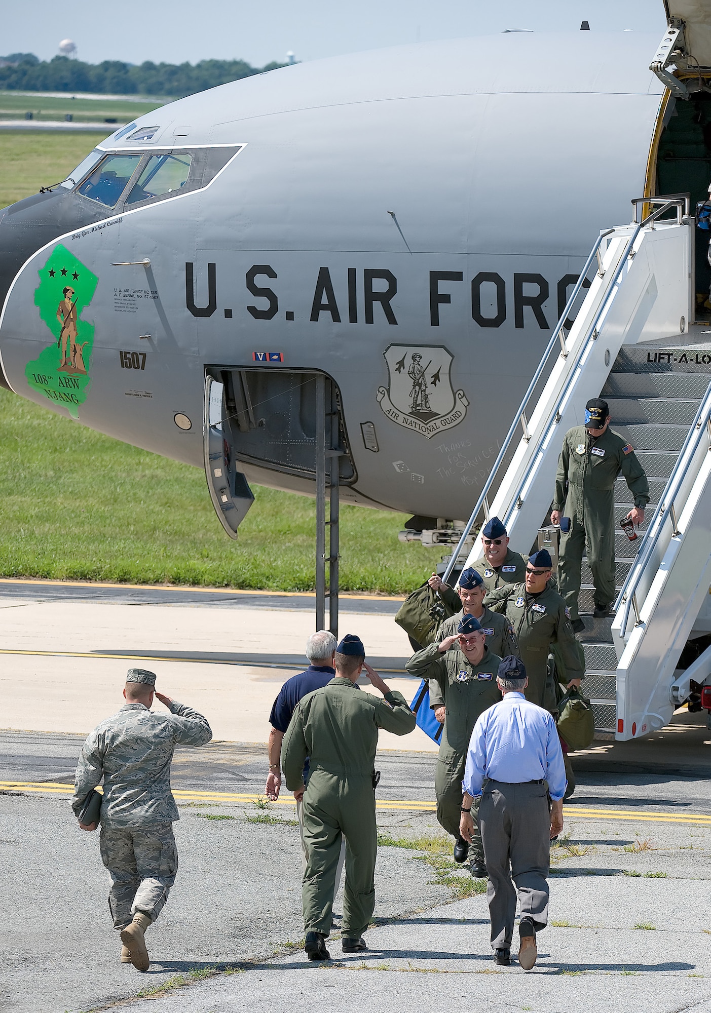 The official party from Dover Air Force Base, Del., greet the crew of the KC-135E Stratotanker.  The aircraft is going to be on display at the Air Mobility Command Museum.  (U.S. Air Force Photo/Jason Minto)