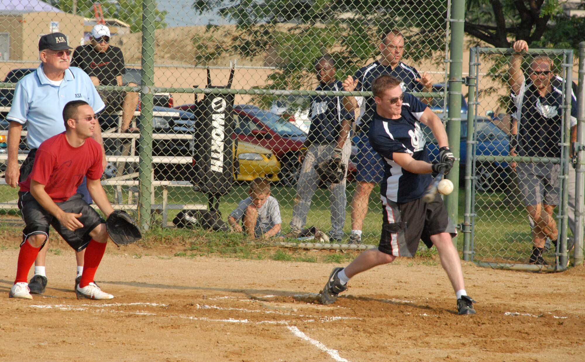 William Brown, 436th Communications Squadron, hits a hard line drive Aug. 3. The 436th CS beat 436th Civil Engineering Squadron 5 - 4. (U.S. Air Force photo/Airman 1st Class Matthew Hubby)