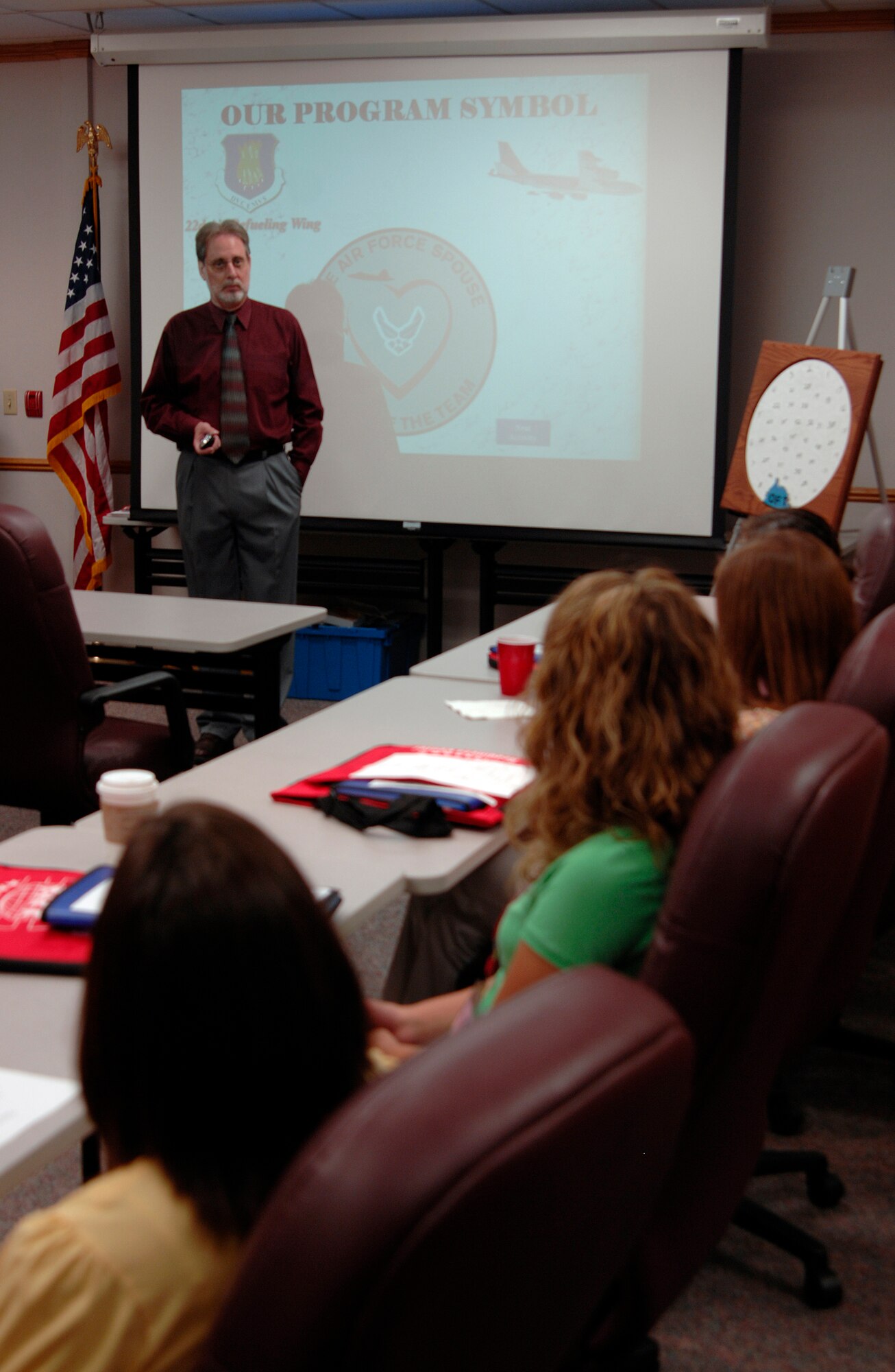 Dennis Chrisco, Airman and Family Readiness Center community readiness consultant, teaches a Heartlink class to McConnell spouses, Aug. 5. The AFRC staff provides numerous programs for military dependents while the military member is deployed or away; to include webcam sessions for the families, pillow program, and Heartlink that introduces families to the base environment. (U.S. Air Force photo/Senior Airman Laura Suttles)