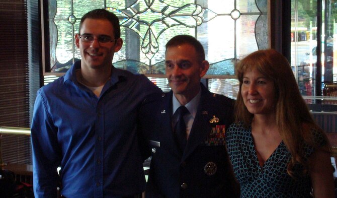 Col. John Patricola, 341st Mission Support Group commander, pauses for a photo with his son, Mike, and his wife, Sam, in July 2008 at a restaurant in Crystal City, Va., following his promotion party. (courtesy photo)    