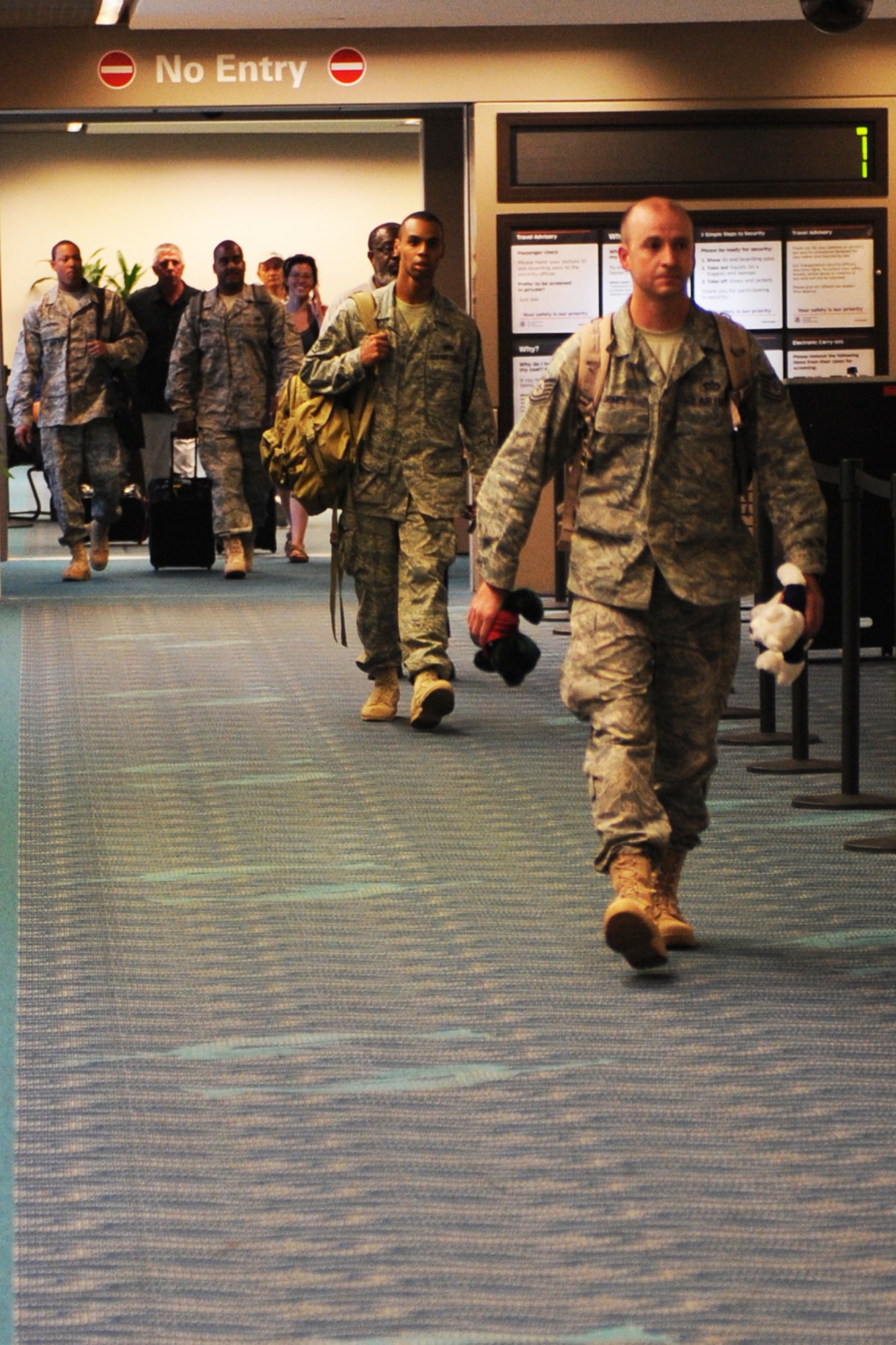 LANGLEY AIR FORCE BASE, Va. -- Individuals from the 1st Civil Engineer Squadron return from their deployment Aug. 6 from Balad, Iraq, at the Norfolk International Airport. (U.S. Air Force photo/Senior Airman Scott Aldridge)
