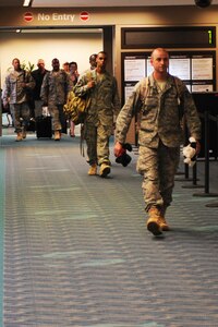 LANGLEY AIR FORCE BASE, Va. -- Individuals from the 1st Civil Engineer Squadron return from their deployment Aug. 6 from Balad, Iraq, at the Norfolk International Airport. (U.S. Air Force photo/Senior Airman Scott Aldridge)