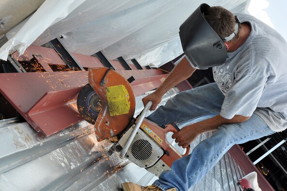 EGLIN AIR FORCE BASE, Fla. – A construction worker cuts a steel beam down to size during an extensive renovation and expansion effort to upgrade the Eglin Commissary August 6. Scheduled for completion in the summer of 2010, the 19-month project hopes to better meet the needs of the customer and update many of the aging areas in the building. This means expansion of the sales floor by 6,000 square feet, a second commissary entrance, parking area and roof. (U.S. Air Force photo/ Airman Anthony Jennings)