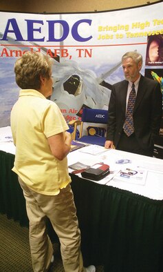 Arnold Engineering Development Center (AEDC) Contracting Officer Alan Fudge answers a question from Jane Davis, with DavisGroupe, about business opportunities at Arnold during the first of a two-day Federal Funding Seminar in Manchester. DavisGroupe, a business based in Murfreesboro, has partnered with a service disabled veteran-owned small business to produce LED lights. Davis said the goal of the people behind the business partnership is to bring quality jobs to disabled veterans in middle Tennessee. (Photo by Philip Lorenz III)
