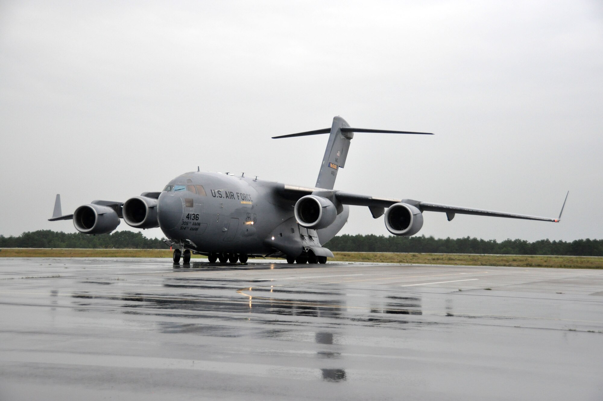 A C-17 Globemaster III from the 305th Air Mobility Wing at McGuire Air Force Base, N.J., taxies on the runway at the Lakehurst Naval Air Station. The aircraft delivered cargo to Airmen and Soldiers with Joint Task Force-Port Opening, who are conducting a training exercise designed to test their ability to open and operate a deployed aerial port and forward supply node. (U.S. Air Force photo/Capt. Dustin Doyle)