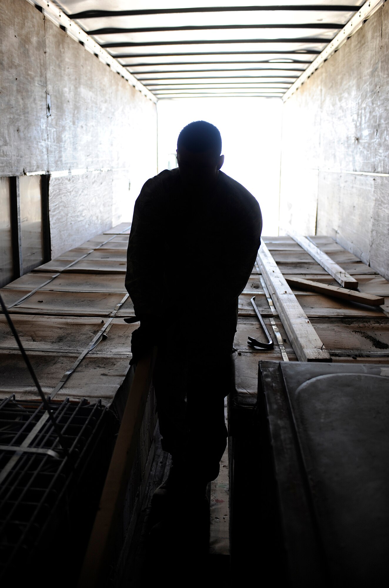 Airman 1st Class Nathaniel Hollister pulls out the blocking and bracing required for the unloading of a incoming shipment of BDU-33's and MAU-93's July 29, 2009, Eielson Air Force Base, Alaska. The shipment is brought in from Elmendorf AFB, Alaska, in support of RED FLAG-Alaska. Airman Hollister is a munitions storage crewmember in the 354th Maintenance Squadron. (U.S. Air Force photo/Airman 1st Class Willard E. Grande II)