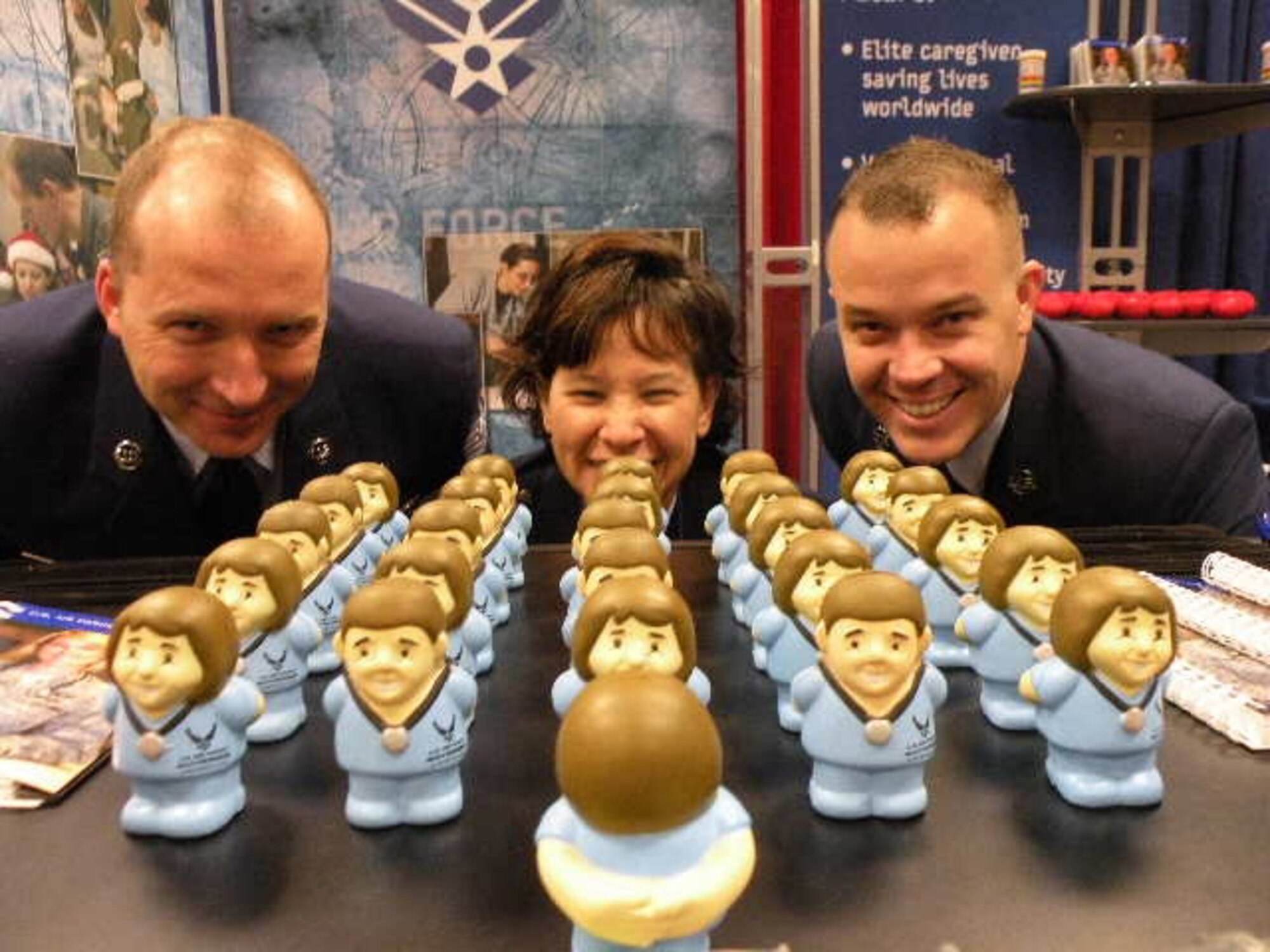 Nurses from Wilford Hall Medical Center and the Air Force Recruiting Service participated in the 34th annual National Association of Hispanic Nurses Conference July 21-24 at the Crowne Plaza Hotel, San Antonio, Texas. More than 300 Hispanic nurses from across the U. S. attended the event.  Lt. Col. Holly Ortega, Capt. Karen Fisher and 2nd Lt. Marisol Pacheco, 59th Inpatient Operations Group, volunteered to serve on a military panel to discuss life as an Air Force nurse and educational benefits. Pictured in front of the Air Force Nurse Recruiting Booth is 
Tech. Sgt. Richard Frederickson (left), Capt. Karen Fisher and Staff Sgt. Michael Payne. Sergeants Frederickson and Payne belong to the 369th Recruiting Group, Lackland AFB, Texas.  (U.S. Air Force photo/2nd Lt. Marisol Pacheco)